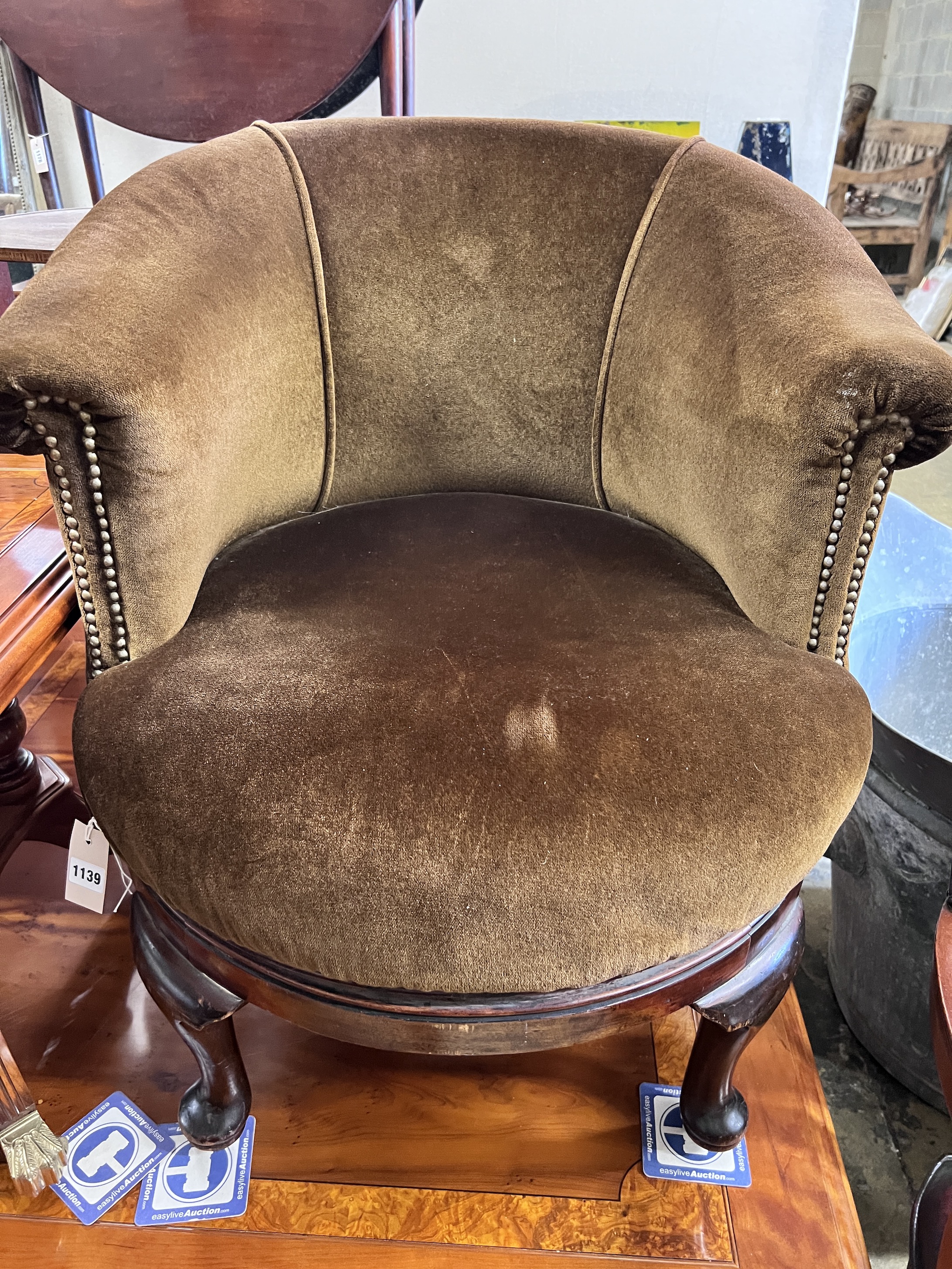 A 1930's mahogany framed revolving tub armchair, width 72cm